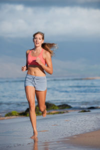 woman-barefoot-running-on-beach1-200x300.jpg